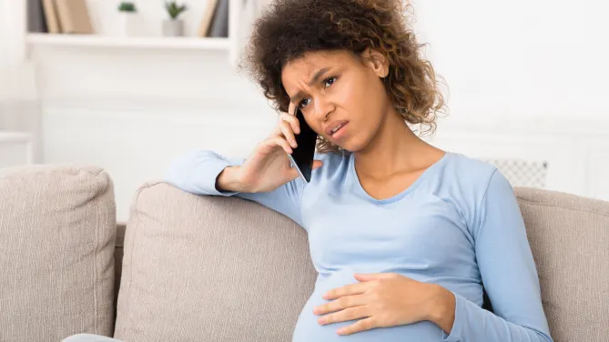 Pregnant woman on phone