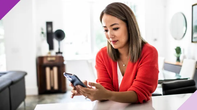 Woman on the phone at the kitchen counter