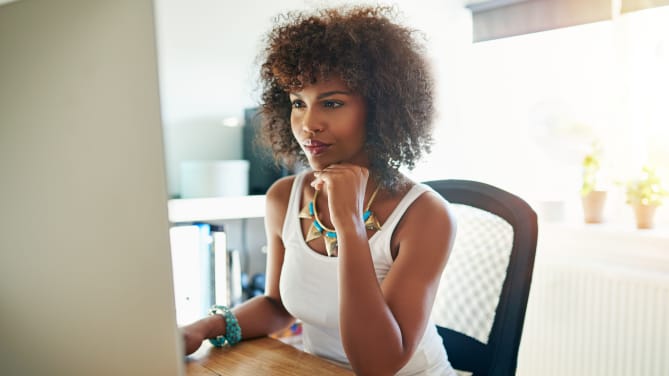Woman writing on computer
