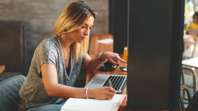 woman writing a cover letter 