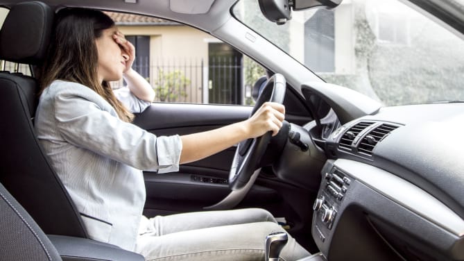 Woman stressed in car