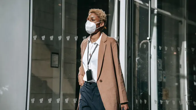 employee wearing a mask in her office