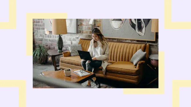 woman sitting on couch staring at laptop