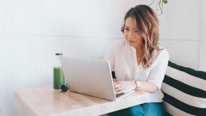 Woman typing on computer