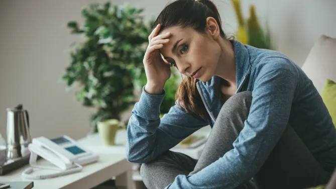 Stressed woman sitting in chair