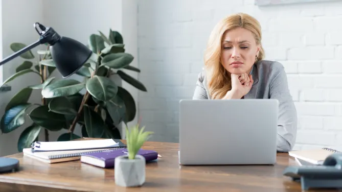 Sad woman on laptop