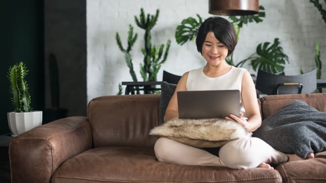 Woman using laptop at home