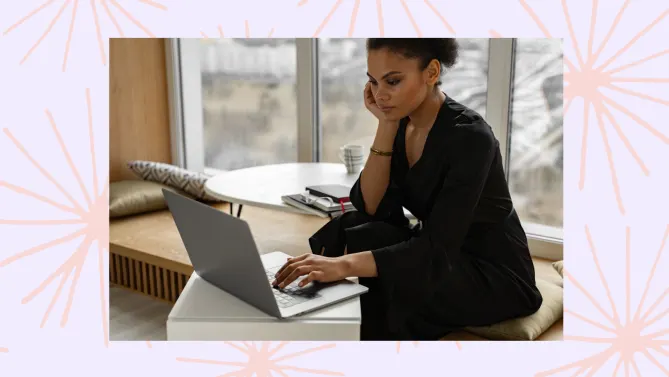 a woman sitting on her computer