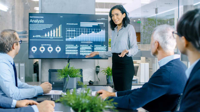 woman presenting pitch deck