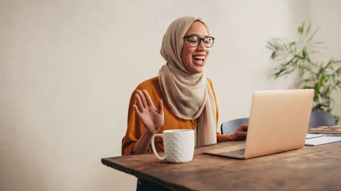 Happy woman on laptop