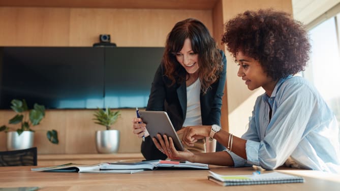 Woman receiving advice from her boss