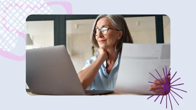 a woman working in front of a laptop