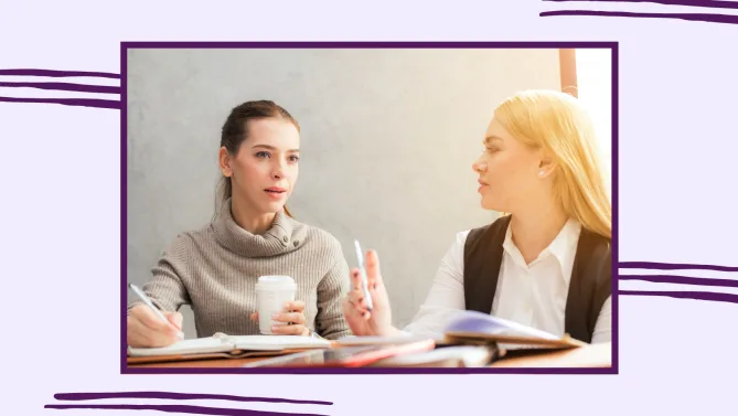 two women talking at work