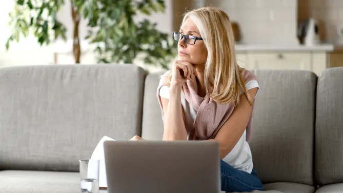 Frustrated woman sitting at desk