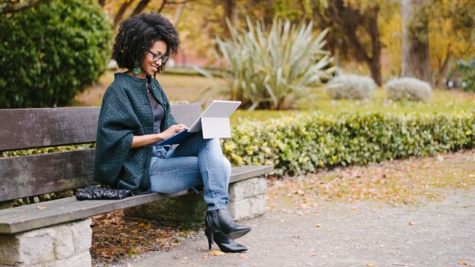 woman outside on her tablet