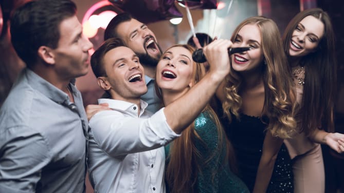 Coworkers singing karaoke