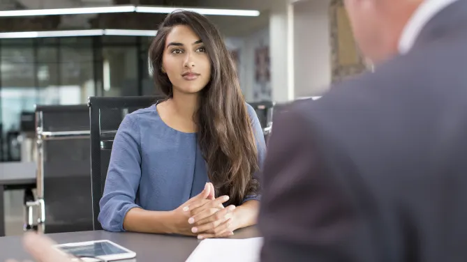Woman watching someone speak