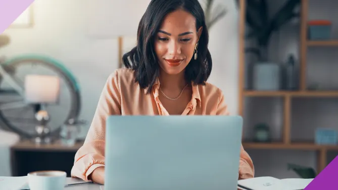 Woman typing email, illustrating what to say instead of “I hope this email finds you well”
