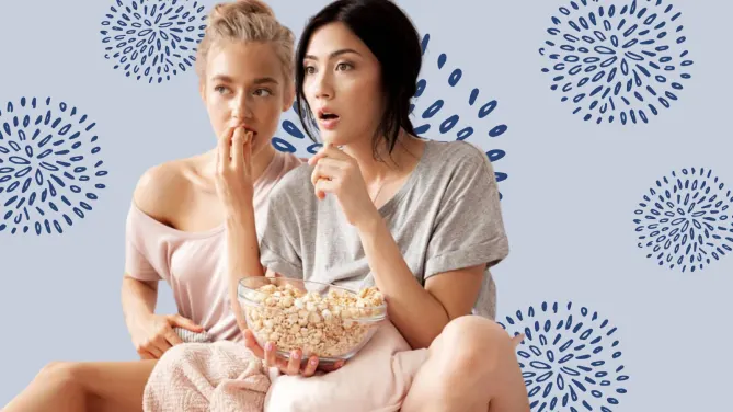 women eating popcorn watching a movie