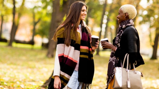 Two women meeting in a park
