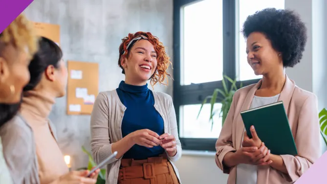 Coworkers in an office setting, illustrating the importance of stopping apologizing at work