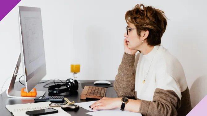 Focused employee in an office setting, illustrating the pros and cons of being detail-oriented at work