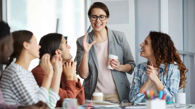 Businesswoman talking to a group