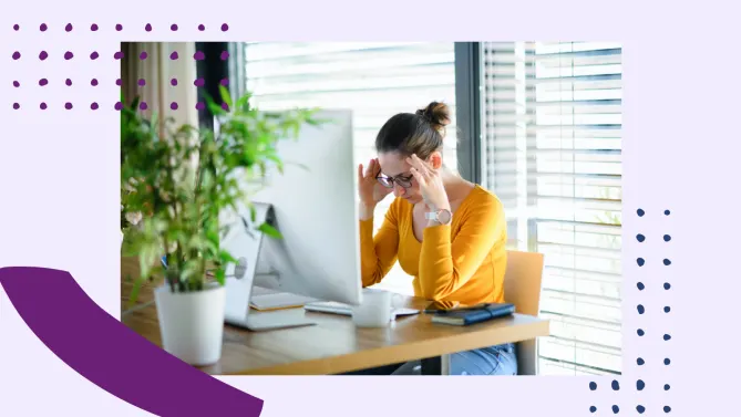Woman stressed at her desk at work. 