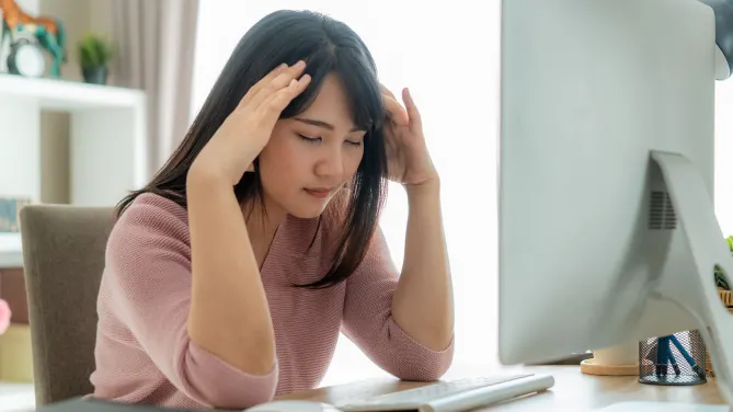 woman frustrated at desk
