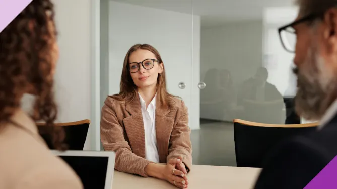 A woman interviewing for a job to illustrate the importance of learning what it means to be overqualified for a job and what to do in these situations