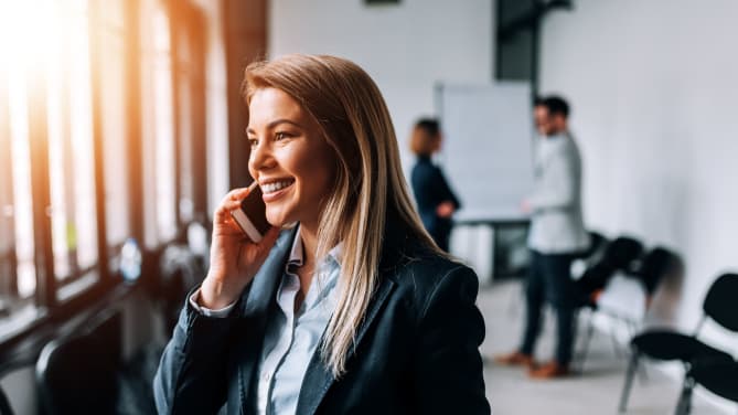 business person smiling on the phone