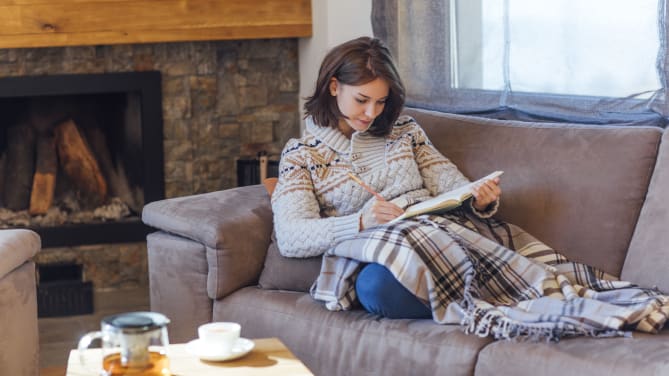 Woman writing down goals