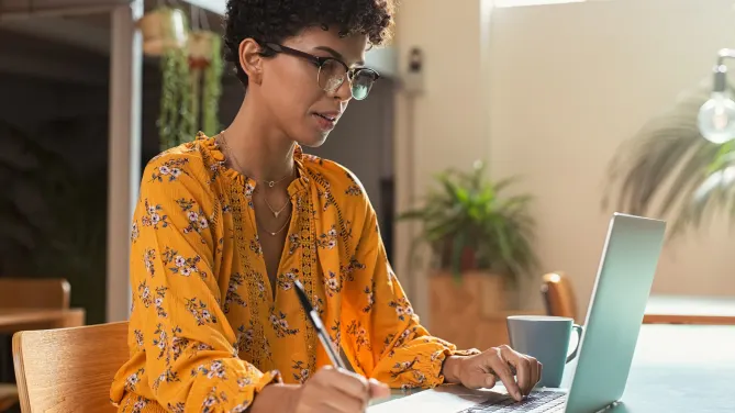 Woman typing on computer