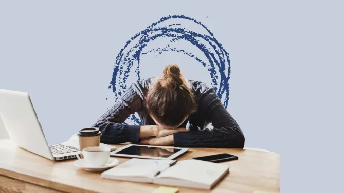 woman with head on desk