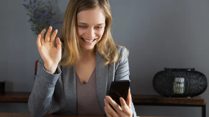 woman recording interview answers with phone
