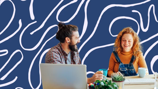 two people working and laughing