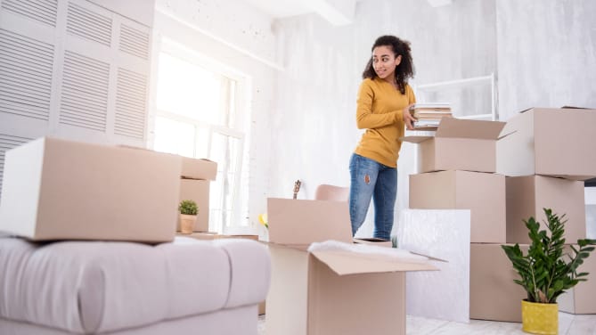 Student unpacking in dorm