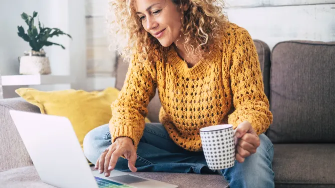 Woman looking at laptop