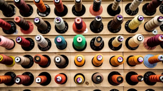 A picture showing multiple colors of thread.