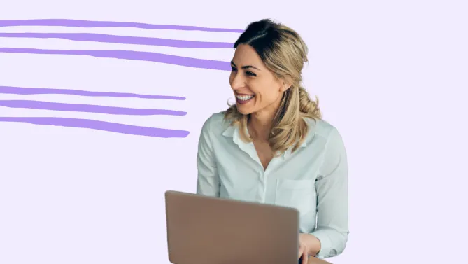 a woman smiling and working on a laptop