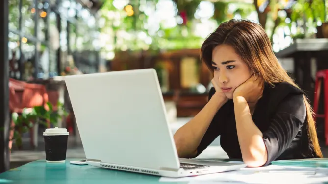 Woman frustrated on laptop