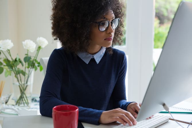 Woman typing on computer