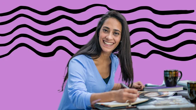 woman writing at her desk