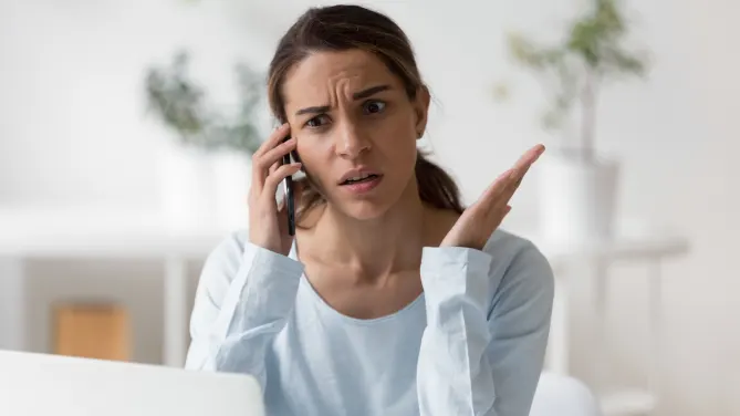 Frustrated woman on the phone