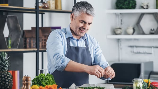 older man cooking