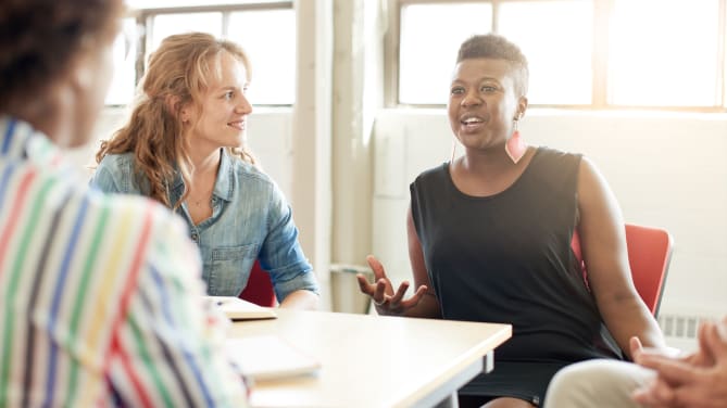 Woman speaking in meeting