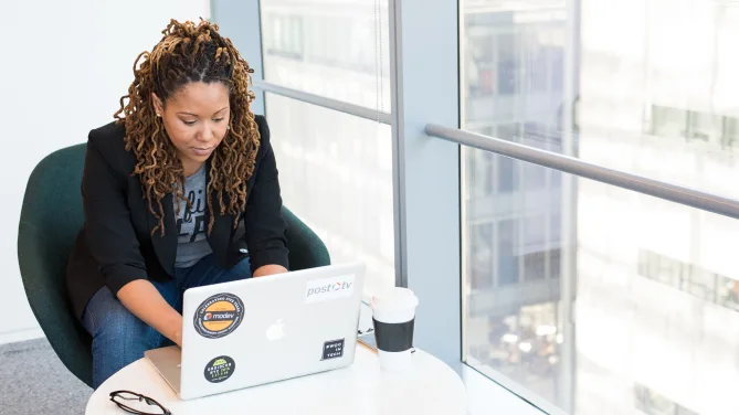 woman typing on laptop