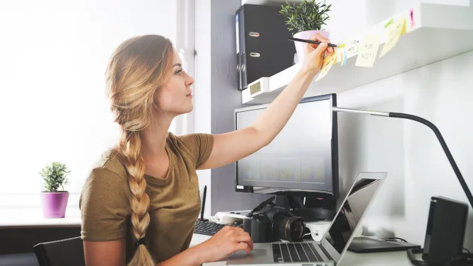 Woman organizing post-it notes