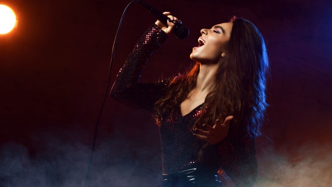 woman with microphone singing