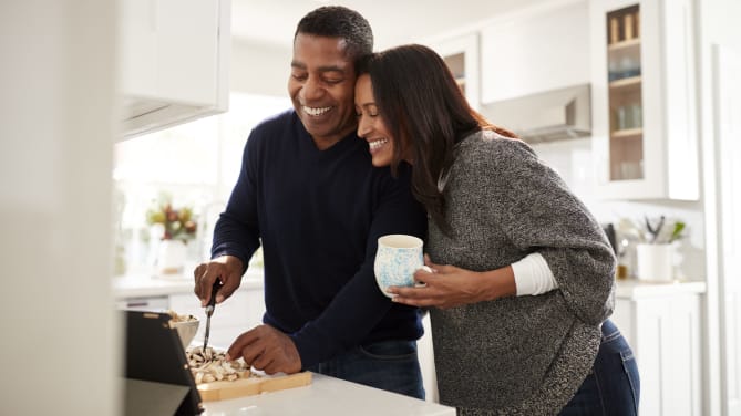 Happy couple cooking